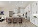 Spacious kitchen with white cabinets, an island, and modern appliances at 1973 W Brooke Ln, Queen Creek, AZ 85144