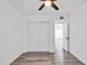Bedroom with grey flooring, double door closet and access to another room at 1873 E Ellis Dr, Tempe, AZ 85282