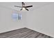 Simple bedroom with grey flooring and a ceiling fan at 1873 E Ellis Dr, Tempe, AZ 85282
