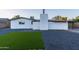 Updated home with artificial turf and gravel backyard at 1873 E Ellis Dr, Tempe, AZ 85282