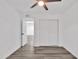Bedroom with grey flooring, double door closet and access to another room at 1873 E Ellis Dr, Tempe, AZ 85282