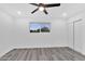 Bedroom with ceiling fan, double closet, and window at 1873 E Ellis Dr, Tempe, AZ 85282