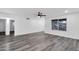 Bright and airy living room with grey flooring and a view of the front yard at 1873 E Ellis Dr, Tempe, AZ 85282