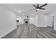Open concept living room with hardwood floors and fireplace at 1873 E Ellis Dr, Tempe, AZ 85282