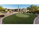 Landscaped backyard with putting green and pool at 25583 N 89Th St, Scottsdale, AZ 85255