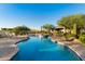 Freeform pool with brick patio and lounge chairs at 25583 N 89Th St, Scottsdale, AZ 85255