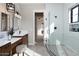 Elegant bathroom with double vanity, white tile shower, and modern fixtures at 43320 N 11Th St, New River, AZ 85087