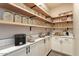 Well-organized pantry with ample shelving for storage at 43320 N 11Th St, New River, AZ 85087