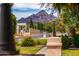 Residential street lined with homes and lush landscaping at 94 Biltmore Est, Phoenix, AZ 85016