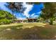 Large grassy backyard with a view of the home's back at 94 Biltmore Est, Phoenix, AZ 85016