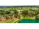 Property showcasing a large lot with mature trees near a golf course and lake at 94 Biltmore Est, Phoenix, AZ 85016