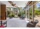 Bright sunroom with pool view and ample seating at 94 Biltmore Est, Phoenix, AZ 85016