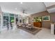 Gathering room with glass doors to backyard and stylish furnishings at 94 Biltmore Est, Phoenix, AZ 85016