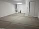 Spacious garage with concrete floor and ample storage space at 7699 W Tether Trl, Peoria, AZ 85383