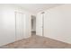 Spacious bedroom with mirrored closet doors and neutral carpeting at 4760 W Wahalla Ln, Glendale, AZ 85308