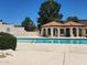 Community pool with covered seating area and lounge chairs at 4760 W Wahalla Ln, Glendale, AZ 85308