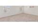 Spacious bedroom with neutral carpeting and large windows at 4760 W Wahalla Ln, Glendale, AZ 85308