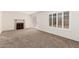 Living room with a fireplace and carpet flooring at 4760 W Wahalla Ln, Glendale, AZ 85308