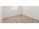 Well-lit bedroom with neutral walls and carpet at 4760 W Wahalla Ln, Glendale, AZ 85308