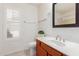 Clean bathroom, featuring wood vanity, toilet and shower at 4760 W Wahalla Ln, Glendale, AZ 85308