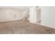 Living room with stairs, carpet flooring, and window shutters at 4760 W Wahalla Ln, Glendale, AZ 85308