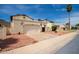 Cute stucco home with a two-car garage and desert landscaping at 4760 W Wahalla Ln, Glendale, AZ 85308