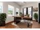 Spacious home office with a large desk and natural light at 6737 E Rockaway Hills Dr, Cave Creek, AZ 85331