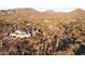 Aerial view of house, desert landscape, and mountain backdrop at 6737 E Rockaway Hills Dr, Cave Creek, AZ 85331