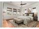 Spacious bedroom with large windows, ceiling fan, and terracotta tile flooring at 6737 E Rockaway Hills Dr, Cave Creek, AZ 85331