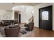 Elegant living room with a spiral staircase and dark brown leather furniture at 6737 E Rockaway Hills Dr, Cave Creek, AZ 85331