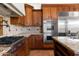 Kitchen features stainless steel appliances and wood cabinetry at 6737 E Rockaway Hills Dr, Cave Creek, AZ 85331