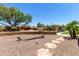 Landscaped backyard oasis featuring a pool and relaxing patio area at 35435 N Windmill Rd, Scottsdale, AZ 85266