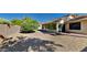 Landscaped backyard with gravel and a citrus tree at 9623 W Wescott Dr, Peoria, AZ 85382