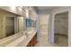 Main bathroom with double vanity, shower, and walk-in closets at 9623 W Wescott Dr, Peoria, AZ 85382