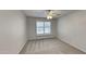 Bright bedroom featuring carpet and ceiling fan at 9623 W Wescott Dr, Peoria, AZ 85382
