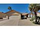 Single-story home with a two-car garage and desert landscaping at 9623 W Wescott Dr, Peoria, AZ 85382