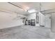Two-car garage with overhead storage and ample space at 5557 W Buckskin Trl, Phoenix, AZ 85083