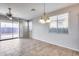 Bright dining area with tile floors and view to backyard at 5557 W Buckskin Trl, Phoenix, AZ 85083
