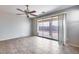 Living room with tile floor and sliding glass doors at 5557 W Buckskin Trl, Phoenix, AZ 85083