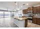 Spacious kitchen with island, stainless steel appliances, and granite countertops at 5557 W Buckskin Trl, Phoenix, AZ 85083