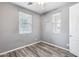 Bright bedroom with wood-look flooring and neutral decor at 5557 W Buckskin Trl, Phoenix, AZ 85083