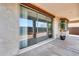 Covered patio with sliding glass doors and a view of the backyard at 5557 W Buckskin Trl, Phoenix, AZ 85083