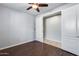 Spacious bedroom with wood-look floors and double doors at 5557 W Buckskin Trl, Phoenix, AZ 85083