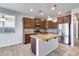 Kitchen with granite countertops, stainless steel appliances, and an island at 5557 W Buckskin Trl, Phoenix, AZ 85083