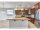 Modern kitchen with granite countertops and stainless steel appliances at 5557 W Buckskin Trl, Phoenix, AZ 85083