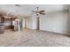 Open kitchen with island and dark wood cabinets at 5557 W Buckskin Trl, Phoenix, AZ 85083