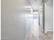 Bright hallway with tile flooring and neutral walls at 5557 W Buckskin Trl, Phoenix, AZ 85083