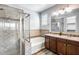 Modern bathroom with double vanity, soaking tub, and walk-in shower at 5557 W Buckskin Trl, Phoenix, AZ 85083