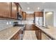 Modern kitchen with stainless steel appliances and granite countertops at 5557 W Buckskin Trl, Phoenix, AZ 85083