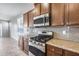 Kitchen features granite countertops and stainless steel appliances at 5557 W Buckskin Trl, Phoenix, AZ 85083